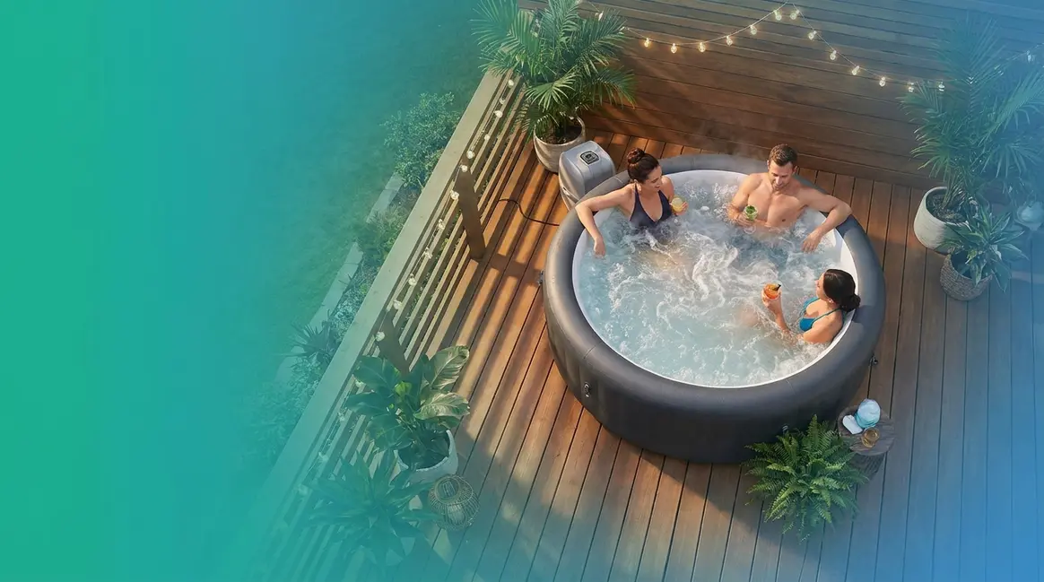Best 3 person hot tub on a wooden patio deck with three adults relaxing at dusk