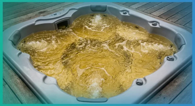 Yellow-tinted hot tub water viewed from above showing discoloured water in a white acrylic tub