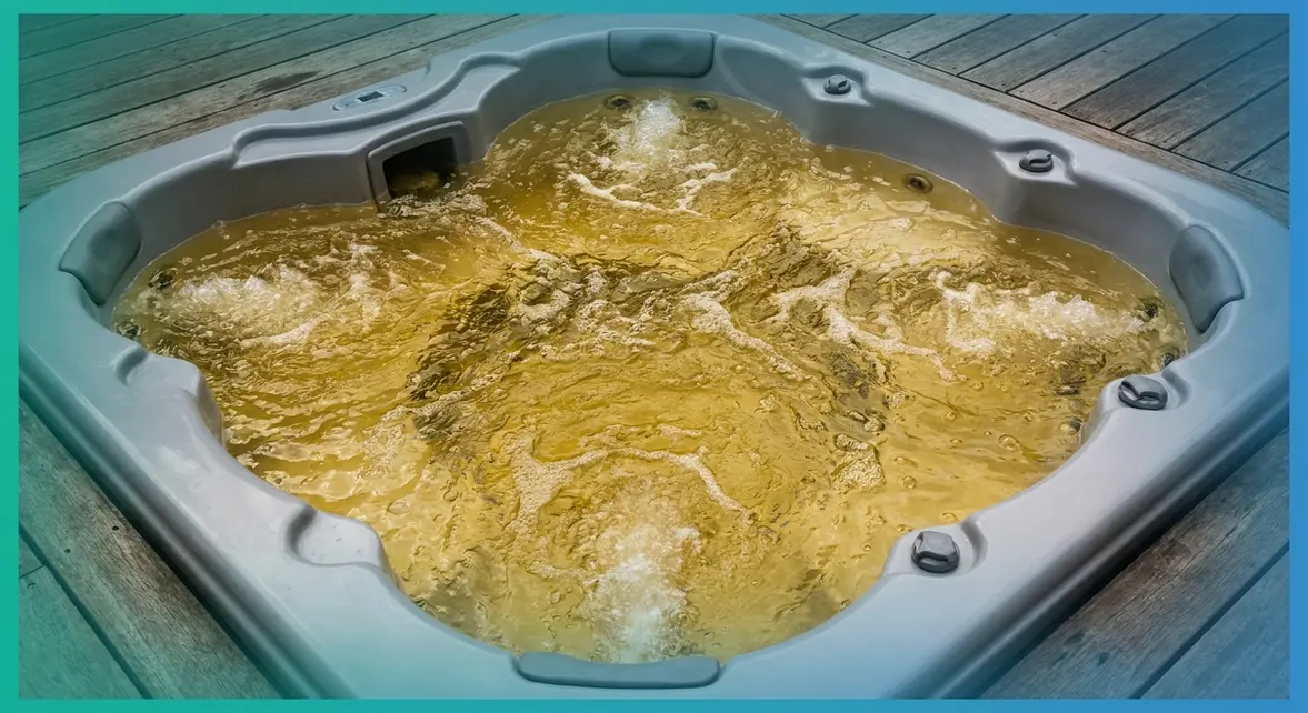 Yellow-tinted hot tub water viewed from above showing discoloured water in a white acrylic tub
